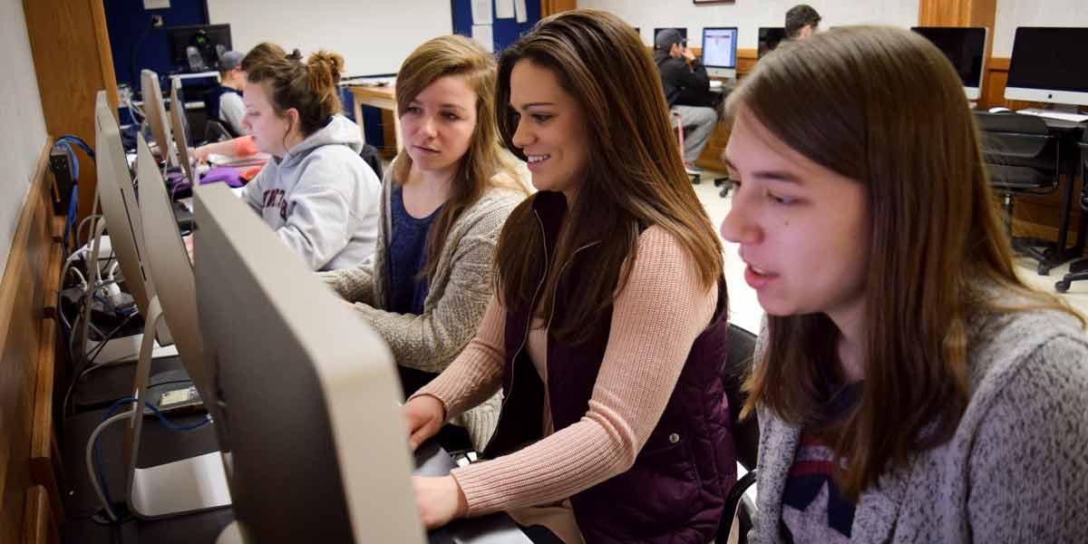 Students in class working at computer stations