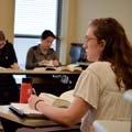 A student takes notes in class