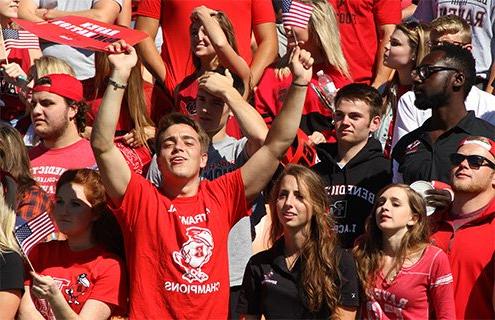 Students cheer at a football game